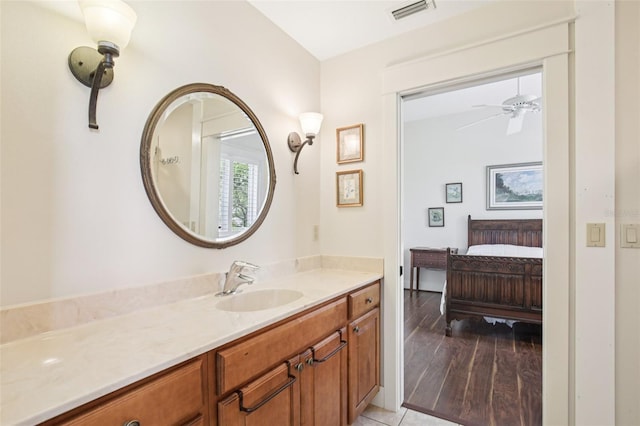 1803 143rd Ct E, Bradenton, FL 34212 - bathroom with vanity, connected bathroom, and a ceiling fan