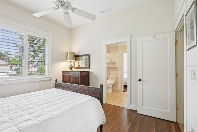 1803 143rd Ct E, Bradenton, FL 34212 - bedroom with dark wood-style flooring, ceiling fan, and ensuite bathroom