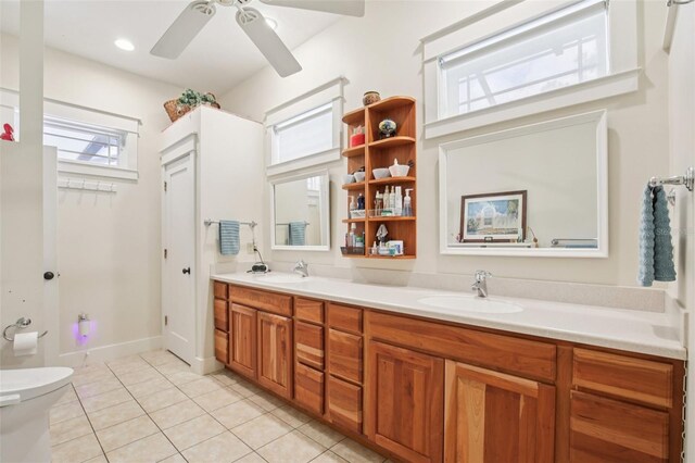 1803 143rd Ct E, Bradenton, FL 34212 - bathroom with tile patterned floors, double vanity, a ceiling fan, and toilet