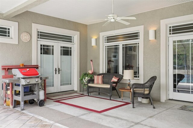 1803 143rd Ct E, Bradenton, FL 34212 - view of exterior entry featuring french doors, stucco siding, ceiling fan, and a patio