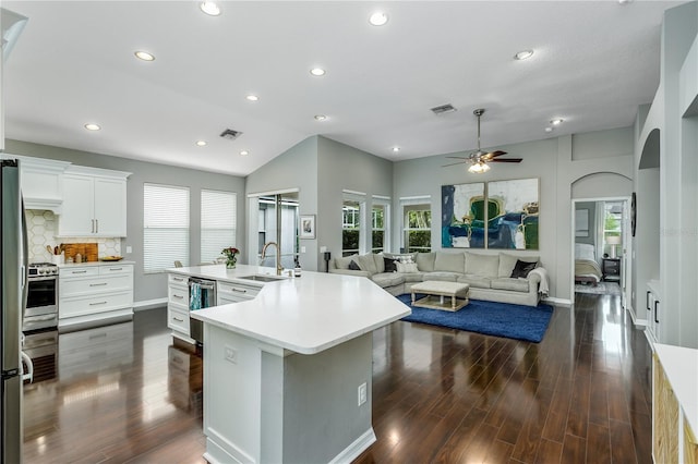 9608 Greenpointe Dr, Tampa, FL 33626 - kitchen featuring a sink, ceiling fan, arched walkways, recessed lighting, and dark wood-type flooring