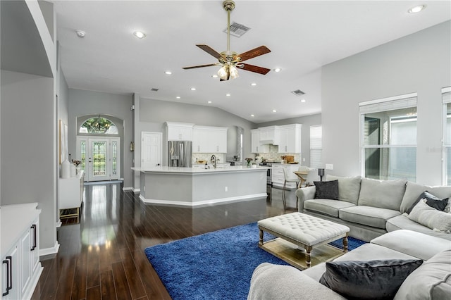9608 Greenpointe Dr, Tampa, FL 33626 - living room featuring ceiling fan, healthy amount of natural light, lofted ceiling, dark wood-type flooring, and recessed lighting