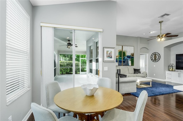 9608 Greenpointe Dr, Tampa, FL 33626 - dining space with ceiling fan, baseboards, wood finished floors, and arched walkways
