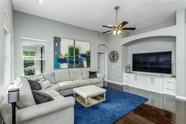 9608 Greenpointe Dr, Tampa, FL 33626 - living room featuring dark wood-type flooring, baseboards, ceiling fan, recessed lighting, and arched walkways