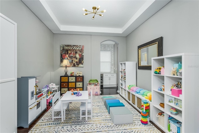 9608 Greenpointe Dr, Tampa, FL 33626 - recreation room with a chandelier and a raised ceiling