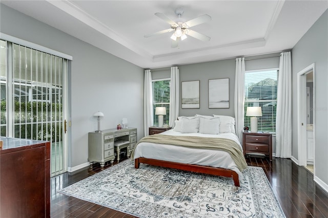9608 Greenpointe Dr, Tampa, FL 33626 - bedroom featuring a raised ceiling, wood finished floors, baseboards, and ceiling fan