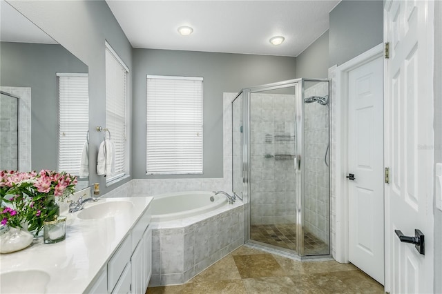 9608 Greenpointe Dr, Tampa, FL 33626 - bathroom with a garden tub, a stall shower, and double vanity