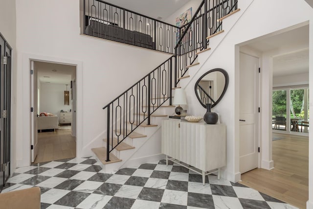 2395 Campbell Rd, Clearwater, FL 33765 - stairway featuring a high ceiling and baseboards
