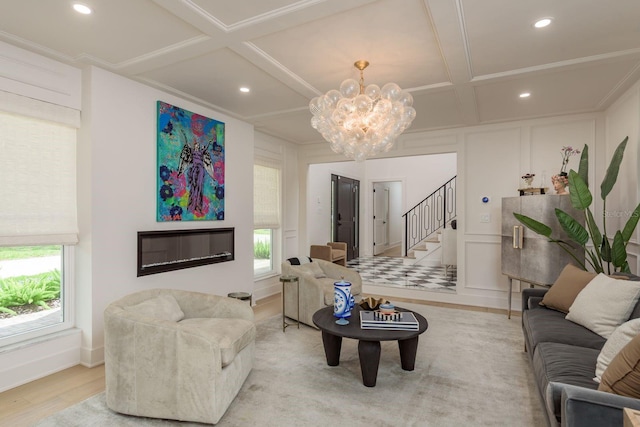 2395 Campbell Rd, Clearwater, FL 33765 - living area featuring coffered ceiling, plenty of natural light, stairway, a chandelier, and a decorative wall
