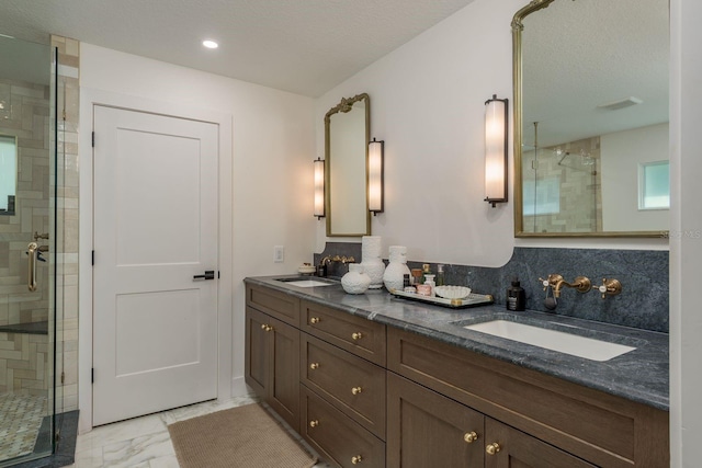 2395 Campbell Rd, Clearwater, FL 33765 - bathroom featuring marble look tiles, a stall shower, and double vanity
