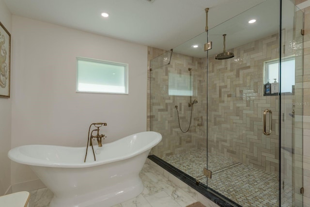 2395 Campbell Rd, Clearwater, FL 33765 - full bathroom with plenty of natural light, a soaking tub, a shower stall, recessed lighting, and marble finish flooring