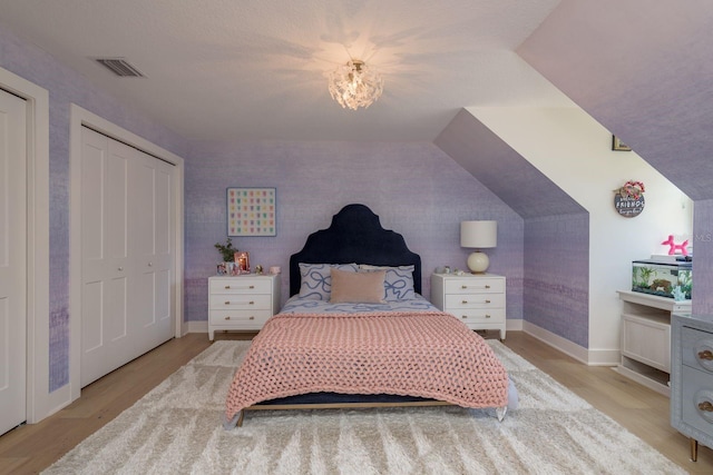 2395 Campbell Rd, Clearwater, FL 33765 - bedroom featuring light wood-type flooring and baseboards