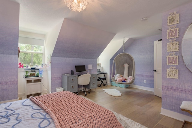2395 Campbell Rd, Clearwater, FL 33765 - bedroom with wood finished floors, vaulted ceiling, and baseboards