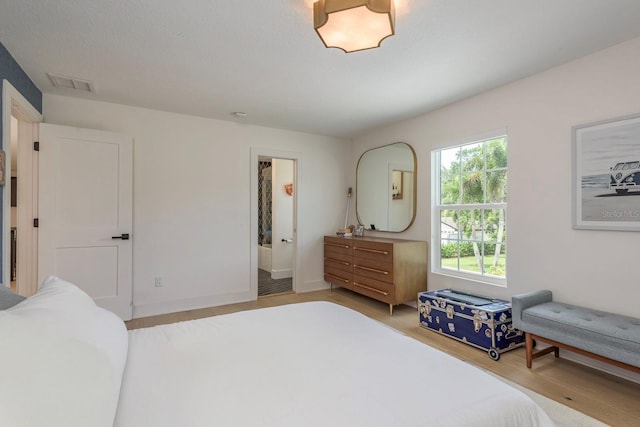2395 Campbell Rd, Clearwater, FL 33765 - bedroom featuring light wood-type flooring and baseboards