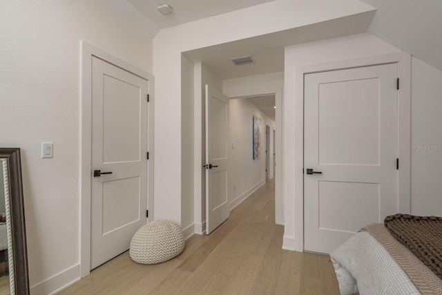 2395 Campbell Rd, Clearwater, FL 33765 - hall with light wood-style floors and baseboards