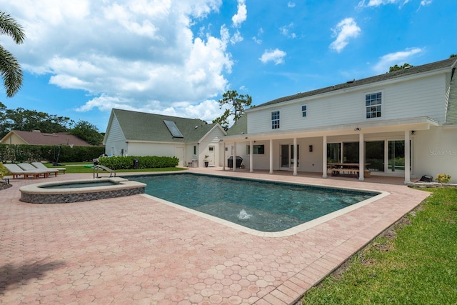 2395 Campbell Rd, Clearwater, FL 33765 - view of pool featuring a patio area, grilling area, and a pool with connected hot tub