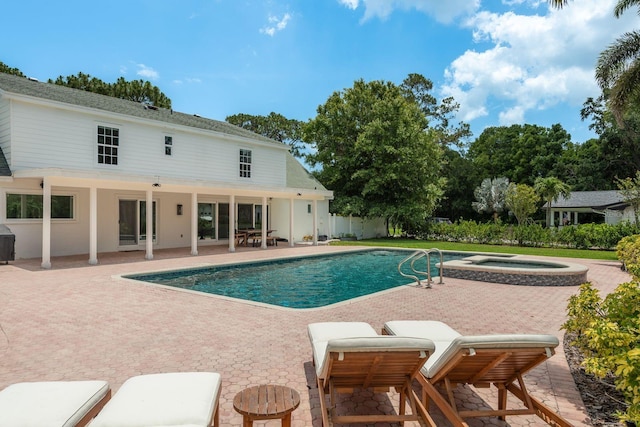 2395 Campbell Rd, Clearwater, FL 33765 - outdoor pool with a patio and an in-ground hot tub