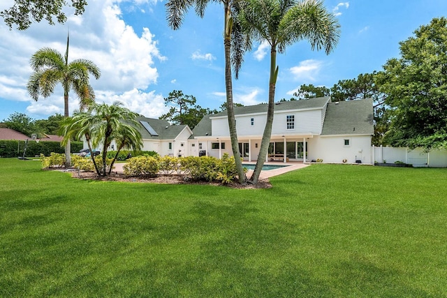 2395 Campbell Rd, Clearwater, FL 33765 - rear view of house with roof with shingles and an outdoor pool