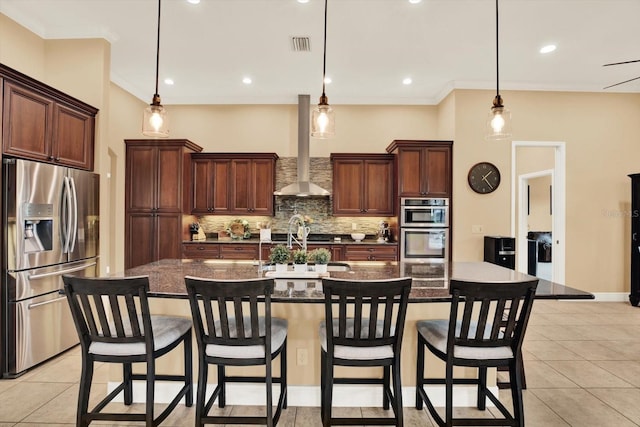 15415 Mulholland Rd, Parrish, FL 34219 - kitchen with appliances with stainless steel finishes, tasteful backsplash, wall chimney exhaust hood, light tile patterned floors, and crown molding