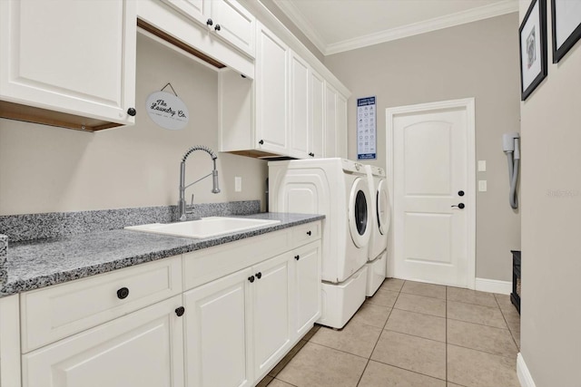 15415 Mulholland Rd, Parrish, FL 34219 - laundry area with washing machine and clothes dryer, crown molding, cabinet space, light tile patterned floors, and baseboards