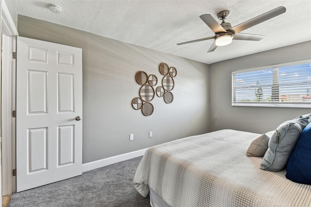 2960 59th St S Unit 303, Gulfport, FL 33707 - carpeted bedroom with a textured ceiling, baseboards, and ceiling fan