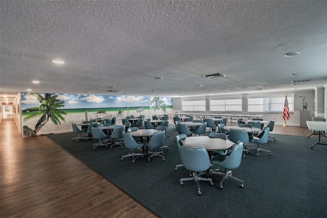 2960 59th St S Unit 303, Gulfport, FL 33707 - workout area featuring wood finished floors and a textured ceiling