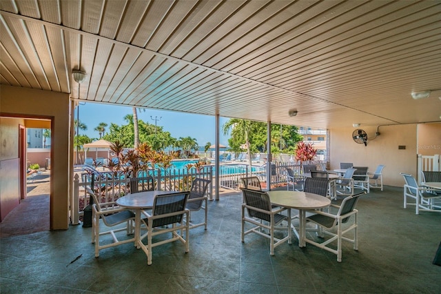2960 59th St S Unit 303, Gulfport, FL 33707 - view of patio with a community pool and outdoor dining space