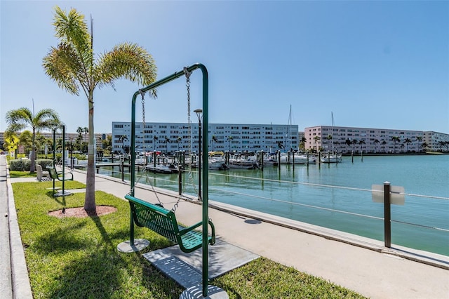2960 59th St S Unit 303, Gulfport, FL 33707 - view of community featuring a water view and a lawn