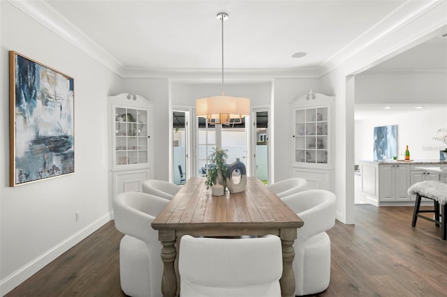 146 26th Ave NE, Saint Petersburg, FL 33704 - dining area featuring dark wood-type flooring, baseboards, and crown molding