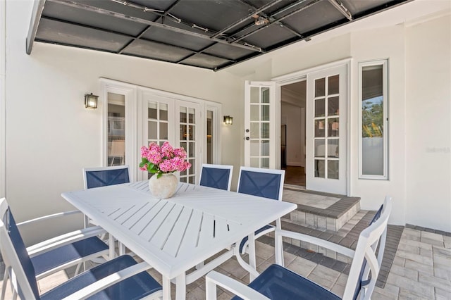 146 26th Ave NE, Saint Petersburg, FL 33704 - view of patio / terrace featuring french doors and outdoor dining space