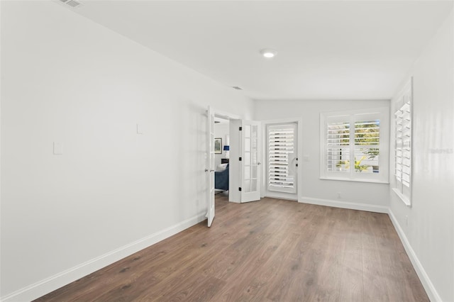 146 26th Ave NE, Saint Petersburg, FL 33704 - empty room featuring wood finished floors and baseboards