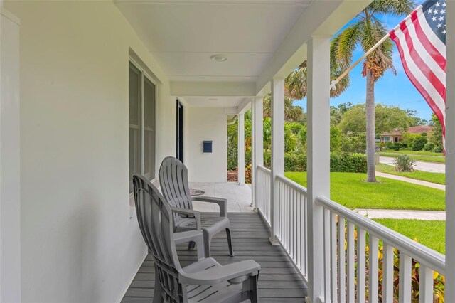 146 26th Ave NE, Saint Petersburg, FL 33704 - porch with a lawn