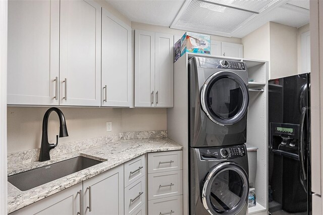 100 Beach Dr NE Unit 301, Saint Petersburg, FL 33701 - laundry area featuring stacked washing machine and dryer