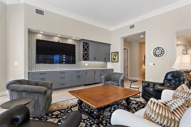 100 Beach Dr NE Unit 301, Saint Petersburg, FL 33701 - living room with crown molding, baseboards, and recessed lighting