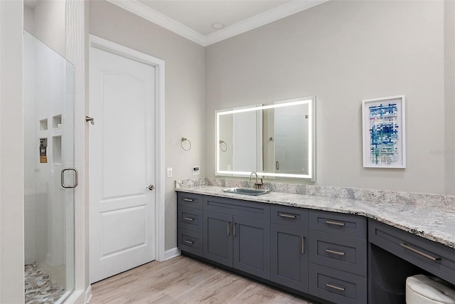 100 Beach Dr NE Unit 301, Saint Petersburg, FL 33701 - full bathroom featuring vanity, a shower stall, ornamental molding, and wood finished floors