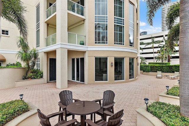 100 Beach Dr NE Unit 301, Saint Petersburg, FL 33701 - back of house featuring stucco siding and a patio area