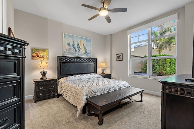 100 Beach Dr NE Unit 301, Saint Petersburg, FL 33701 - bedroom with light colored carpet, baseboards, and a ceiling fan