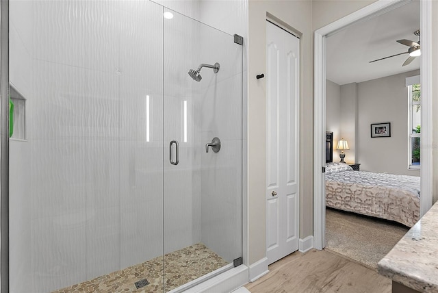 100 Beach Dr NE Unit 301, Saint Petersburg, FL 33701 - ensuite bathroom with a shower stall, wood finished floors, ceiling fan, and baseboards