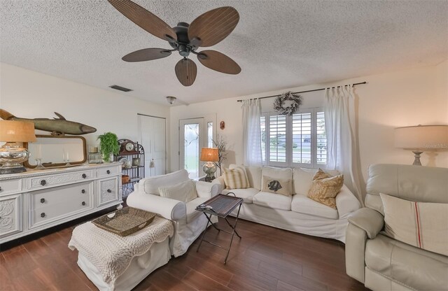 1224 W Del Webb Blvd, Sun City Center, FL 33573 - living area featuring a textured ceiling, dark wood-type flooring, and a ceiling fan