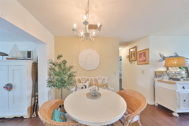 1224 W Del Webb Blvd, Sun City Center, FL 33573 - dining space with wood finished floors, a chandelier, and a textured ceiling