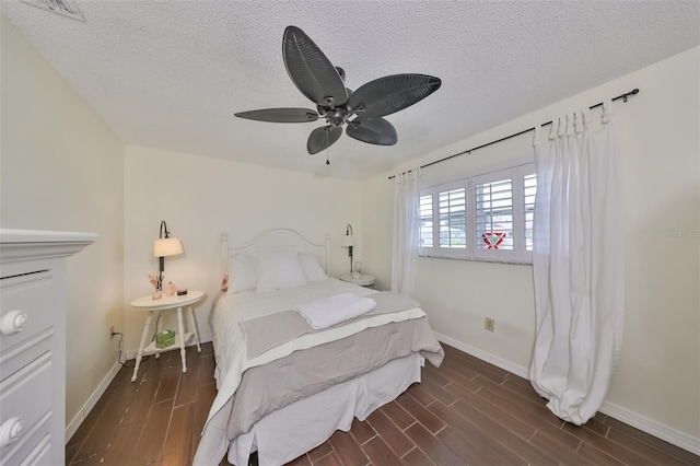 1224 W Del Webb Blvd, Sun City Center, FL 33573 - bedroom with wood finished floors, a textured ceiling, and a ceiling fan