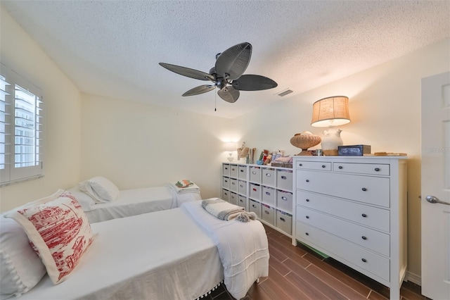 1224 W Del Webb Blvd, Sun City Center, FL 33573 - bedroom with a textured ceiling, dark wood-style floors, and ceiling fan