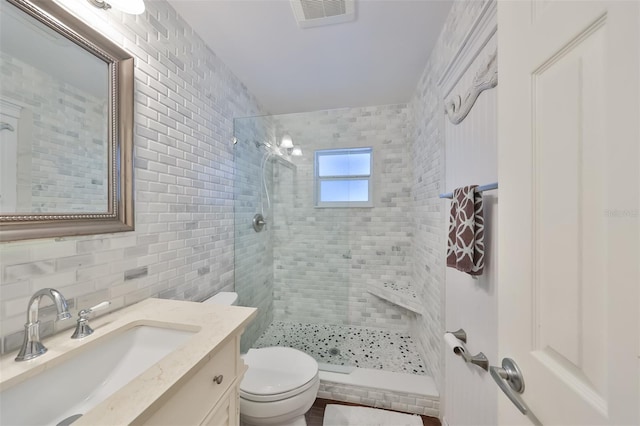 1224 W Del Webb Blvd, Sun City Center, FL 33573 - full bathroom with a tile shower, vanity, tasteful backsplash, and tile walls