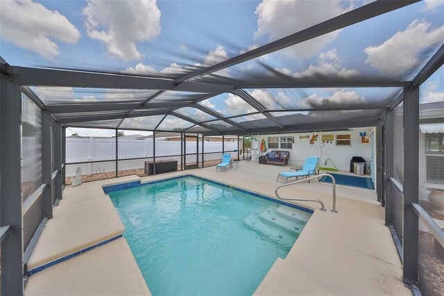 1224 W Del Webb Blvd, Sun City Center, FL 33573 - view of swimming pool featuring a patio and glass enclosure