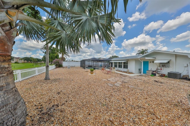 1224 W Del Webb Blvd, Sun City Center, FL 33573 - fenced backyard featuring glass enclosure