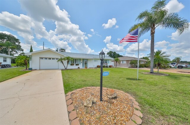 1224 W Del Webb Blvd, Sun City Center, FL 33573 - ranch-style home featuring a garage, a front lawn, and driveway