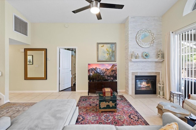4047 Eagle Cove W Dr, Palm Harbor, FL 34685 - tiled living area featuring a ceiling fan and a large fireplace