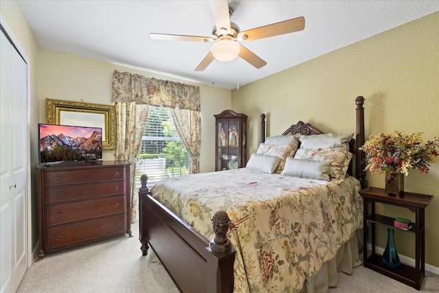 4047 Eagle Cove W Dr, Palm Harbor, FL 34685 - bedroom featuring light carpet, a closet, and ceiling fan