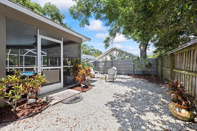 4047 Eagle Cove W Dr, Palm Harbor, FL 34685 - fenced backyard with a patio area and a sunroom