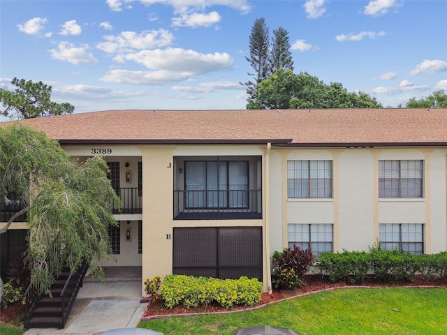 3389 Crystal Ct E J, Unit J, Palm Harbor, FL 34685 - view of building exterior with stairs